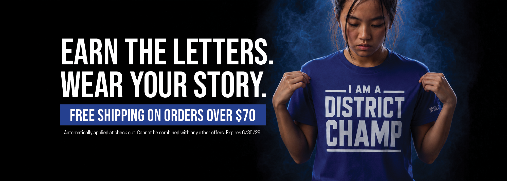 Person wearing a blue t-shirt with 'I am a District Champ' text, promotional banner with text overlay.