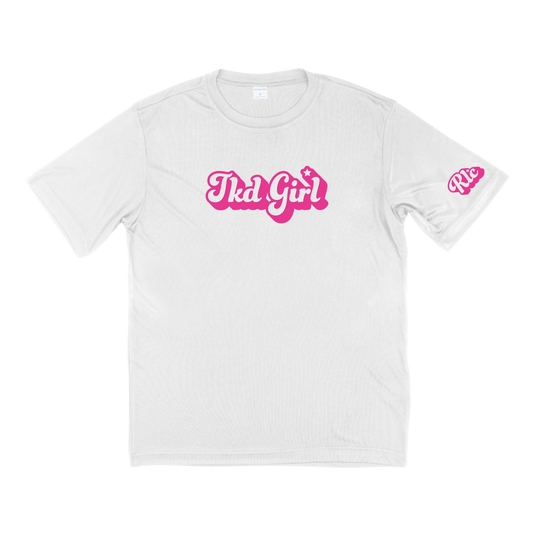 White shirt with TKD Girl in bubble letters in pink on front of shirt and RLC logo in bubble letters in pink on left sleeve.